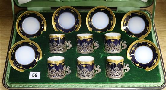 A cased Limoges tea set with silver cup holders
